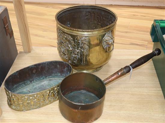 A 19th century oval embossed brass planter and an early copper pan and a Dutch brass log bin